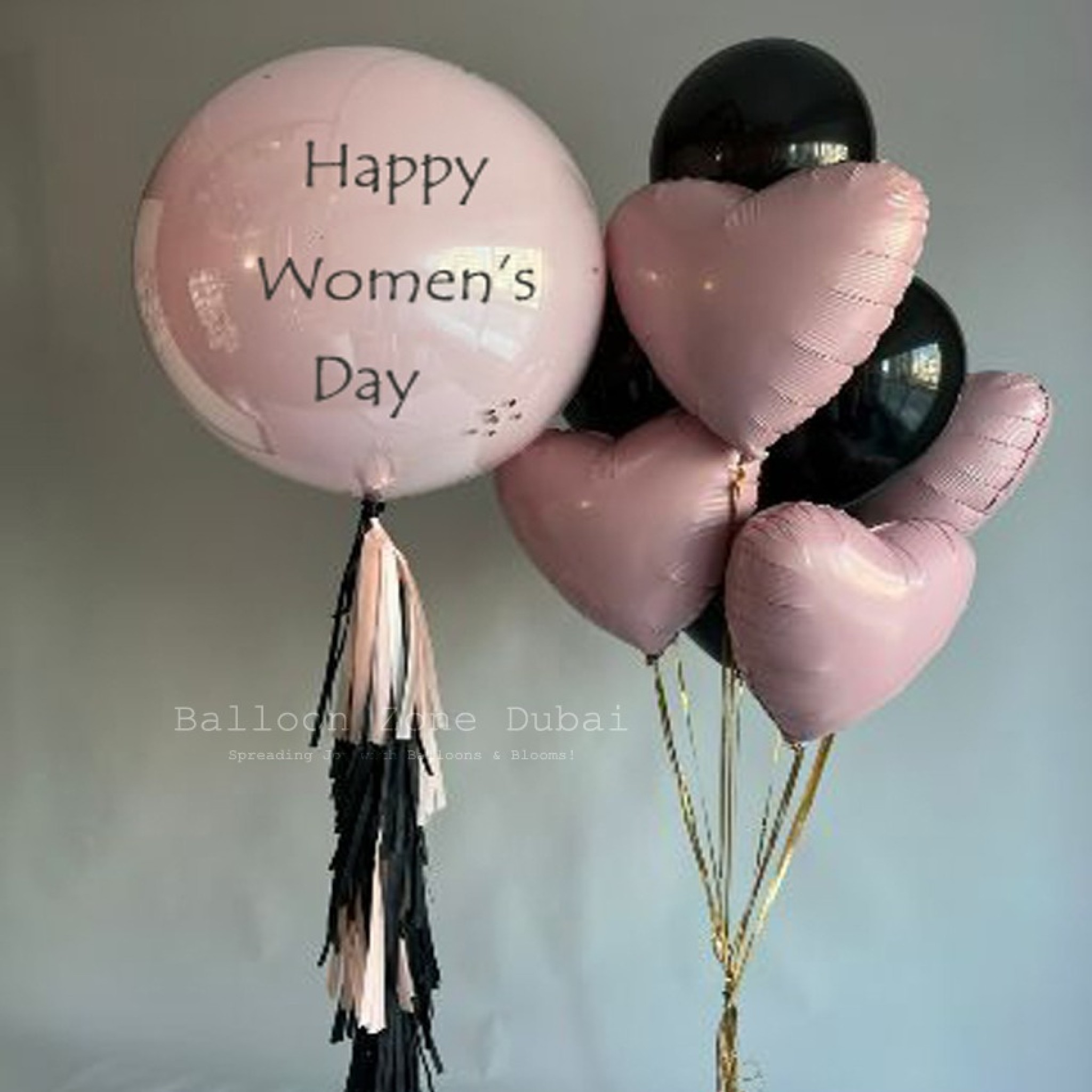 Elegant Womenâ€™s Day Pastel Pink & Black Balloon Bouquet with Tassel Fringe