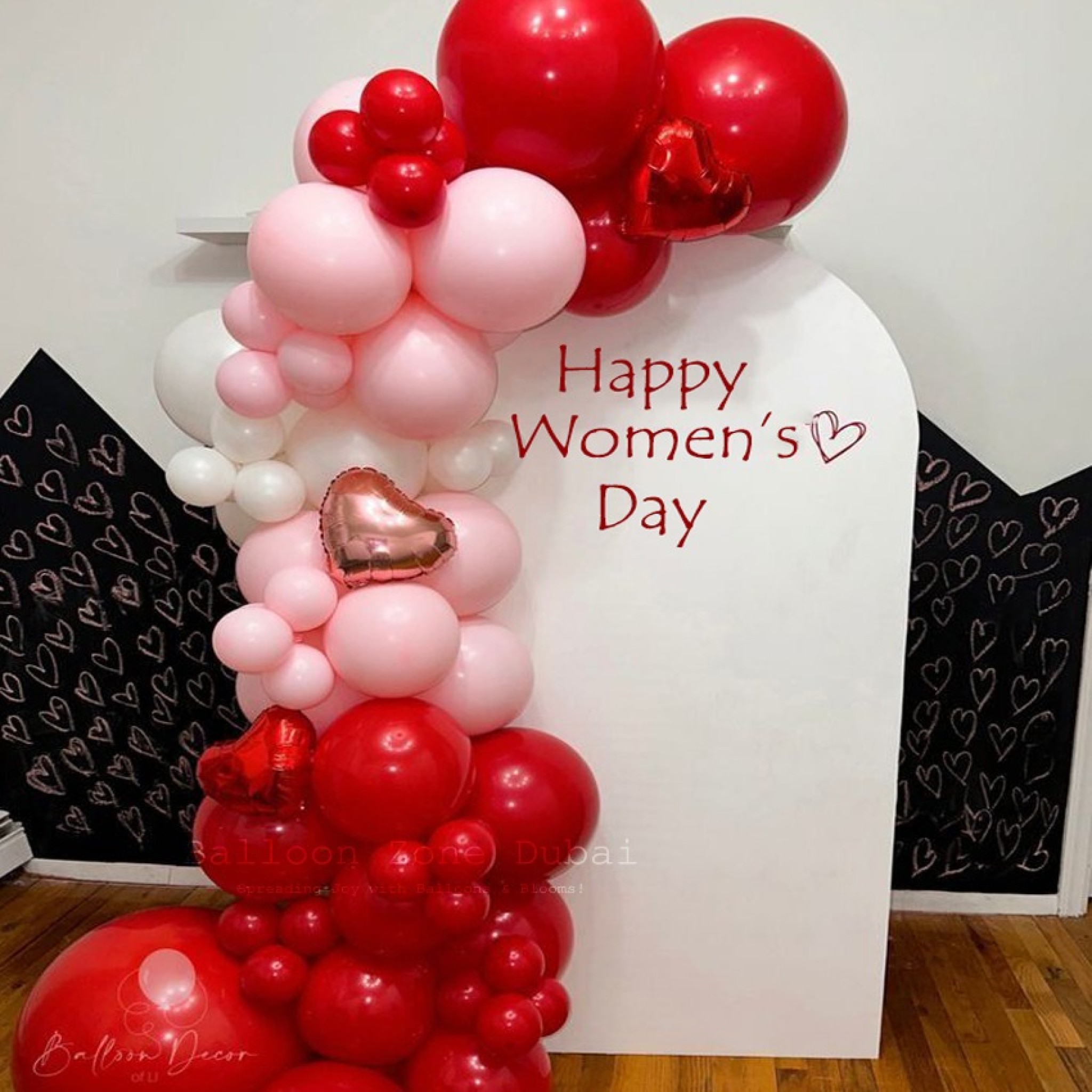 Happy Womenâ€™s Day Balloon Backdrop with Organic Red, Pink & White 